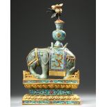 A CHINESE JADE AND CLOISONNÉ CAPARISONED ELEPHANT ON A CLOISONNÉ BASE