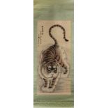 A CHINESE HANGING SCROLL WITH A POLYCHROME PAINTING OF A TIGER