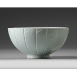 A CHINESE RELIEF DECORATED WHITE GLAZED 'LOTUS' BOWL