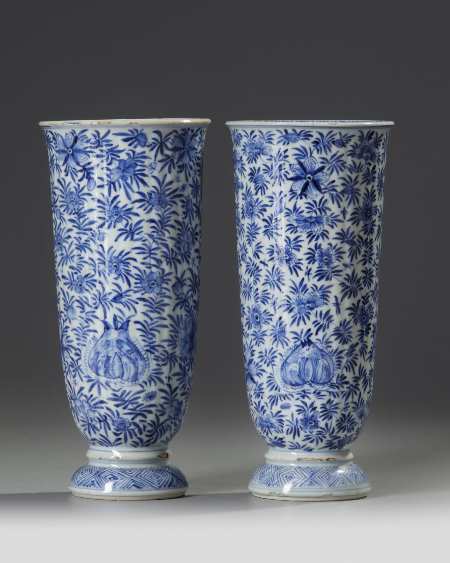 A PAIR OF CHINESE BLUE AND WHITE BEAKER VASES