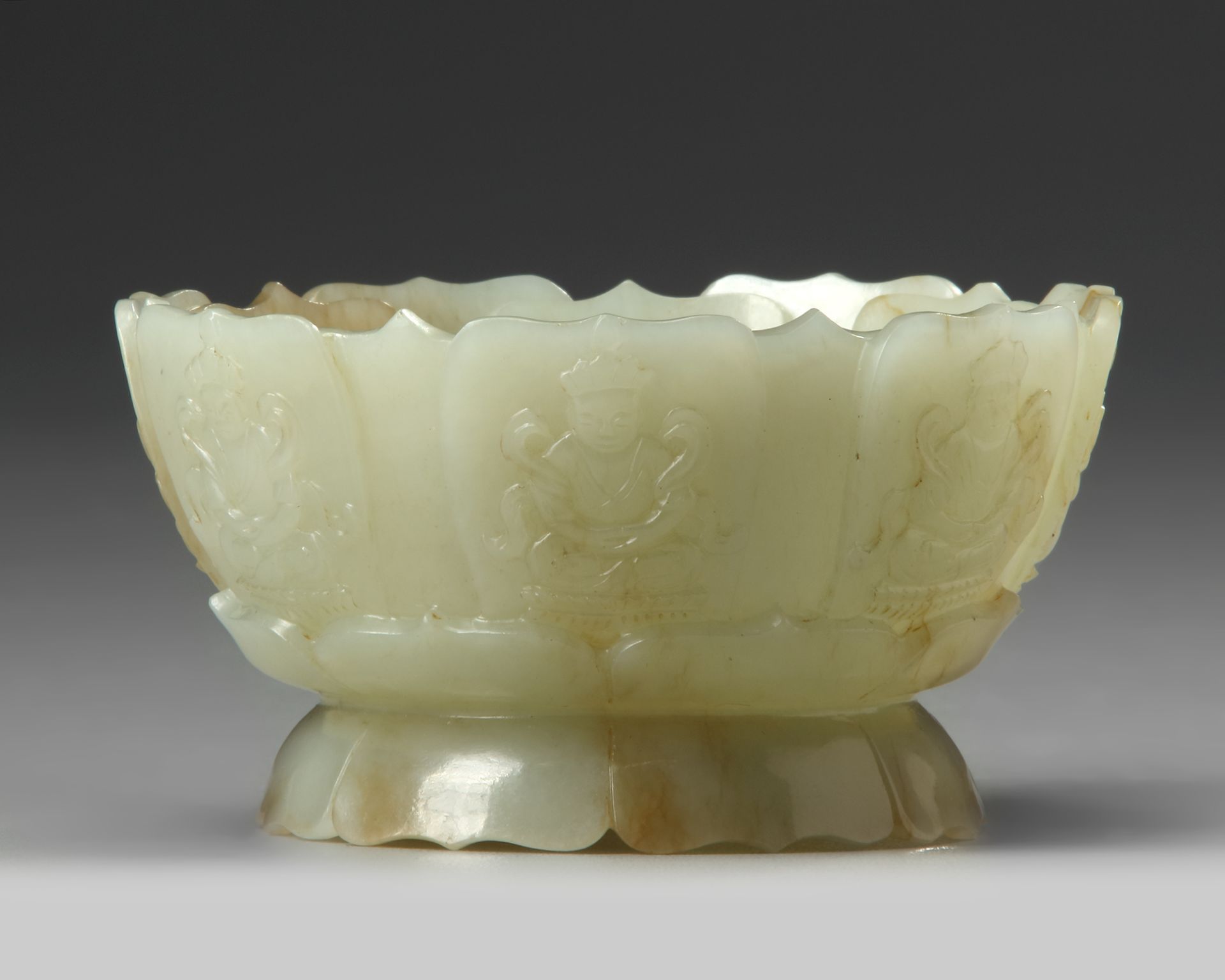 A CHINESE PALE AND RUSSET CARVED JADE 'LOTUS' CENSER