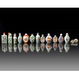 A GROUP OF THIRTEEN CHINESE FAMILLE ROSE SNUFF BOTTLES