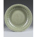 A LARGE LONGQUAN CELADON BARBED-RIM DISH