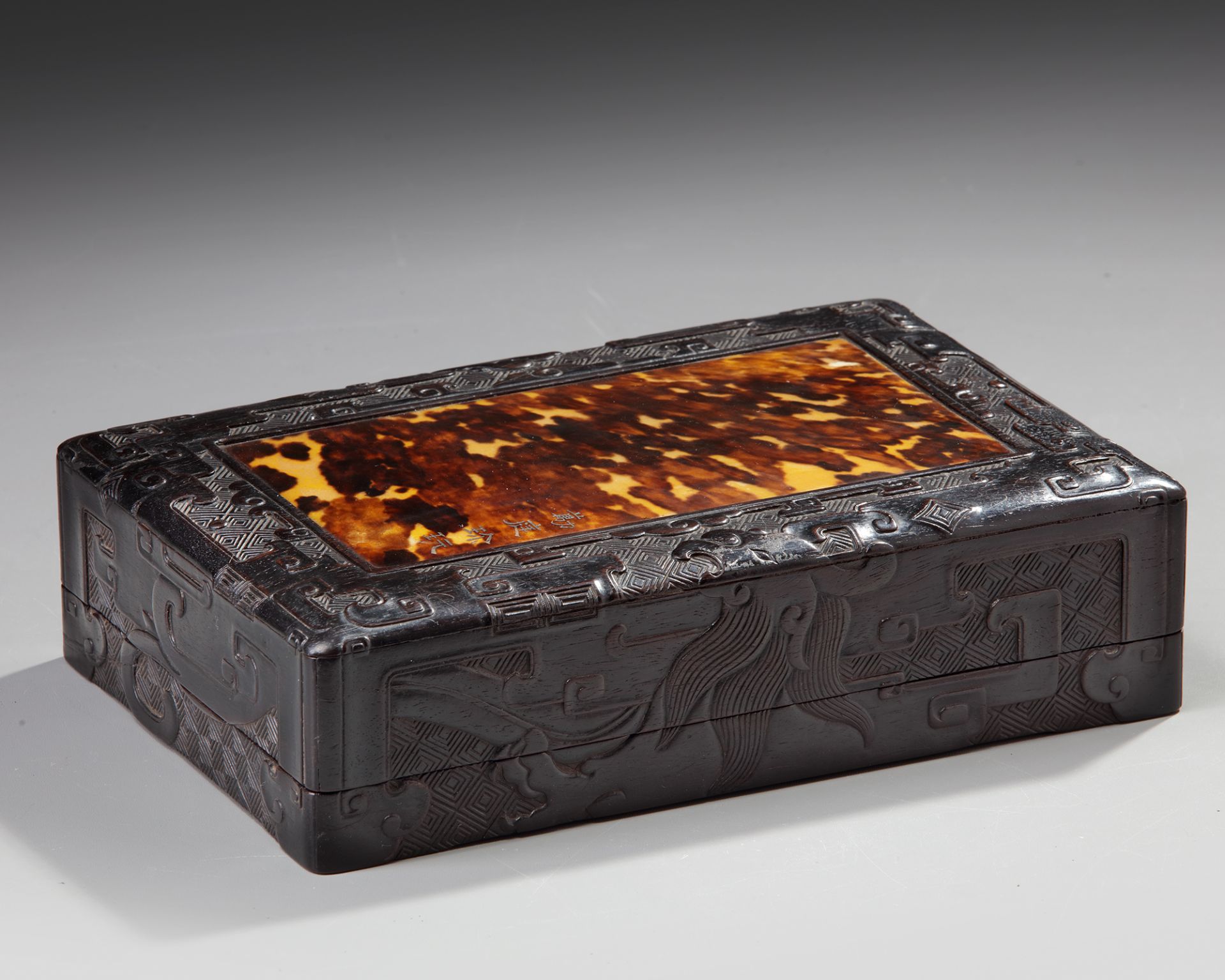 A CHINESE HARDWOOD AND FAUX-TORTOISESHELL BOX AND COVER