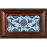 A PAIR OF FRAMED IZNIK TILES