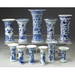A GROUP OF TEN CHINESE BLUE AND WHITE BEAKER VASES