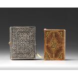 AN ILLUMINTATED MINIATURE OTTOMAN QURAN AND SILVER CASE