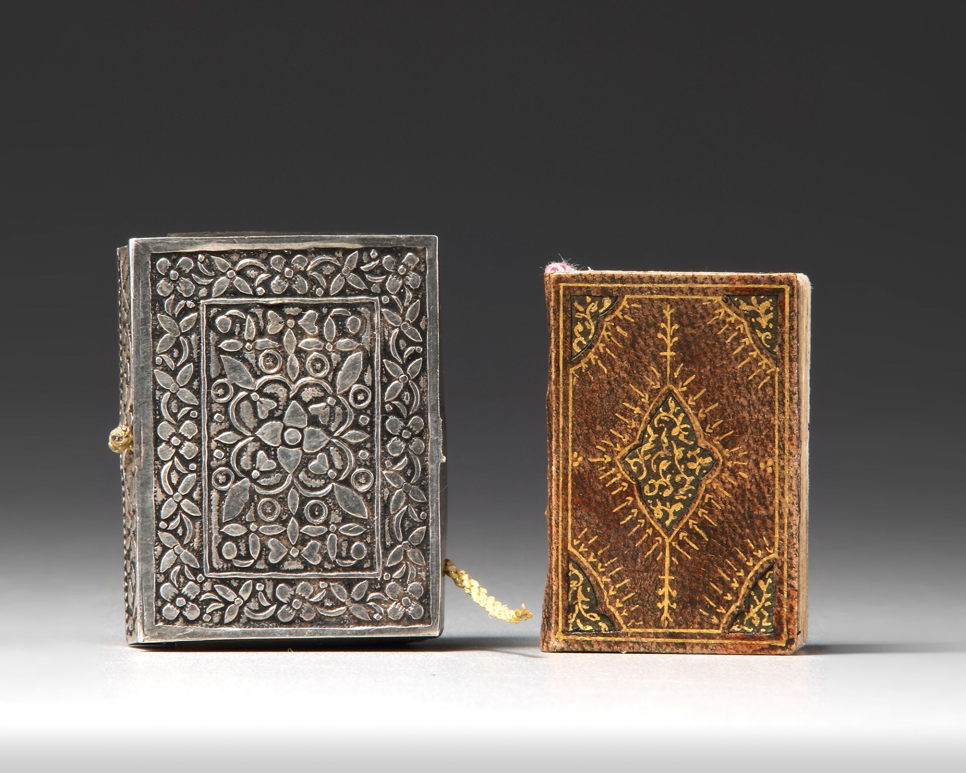 AN ILLUMINTATED MINIATURE OTTOMAN QURAN AND SILVER CASE