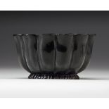 A MUGHAL BLACK GLAZED LOTUS SHAPED CERAMIC BOWL