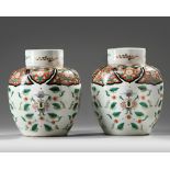 A PAIR OF FAMILLE ROSE GINGER JARS AND COVERS