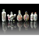 A GROUP OF FIVE CHINESE FAMILLE ROSE SNUFF BOTTLES