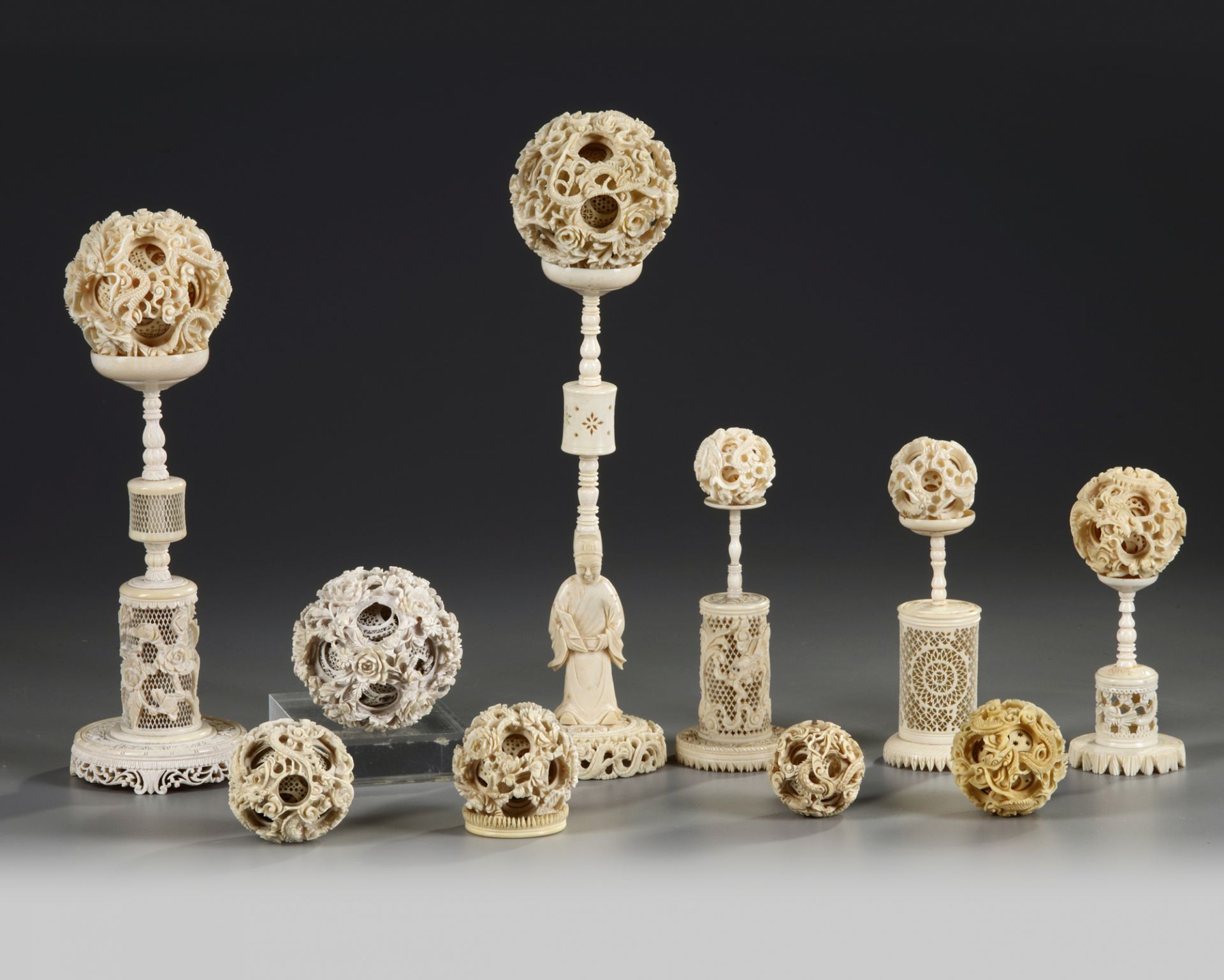 A GROUP OF CANTONESE CARVED PUZZLE BALLS AND STANDS