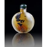 A CHINESE SHADOW AGATE 'EAGLE AND BEAR' SNUFF BOTTLE