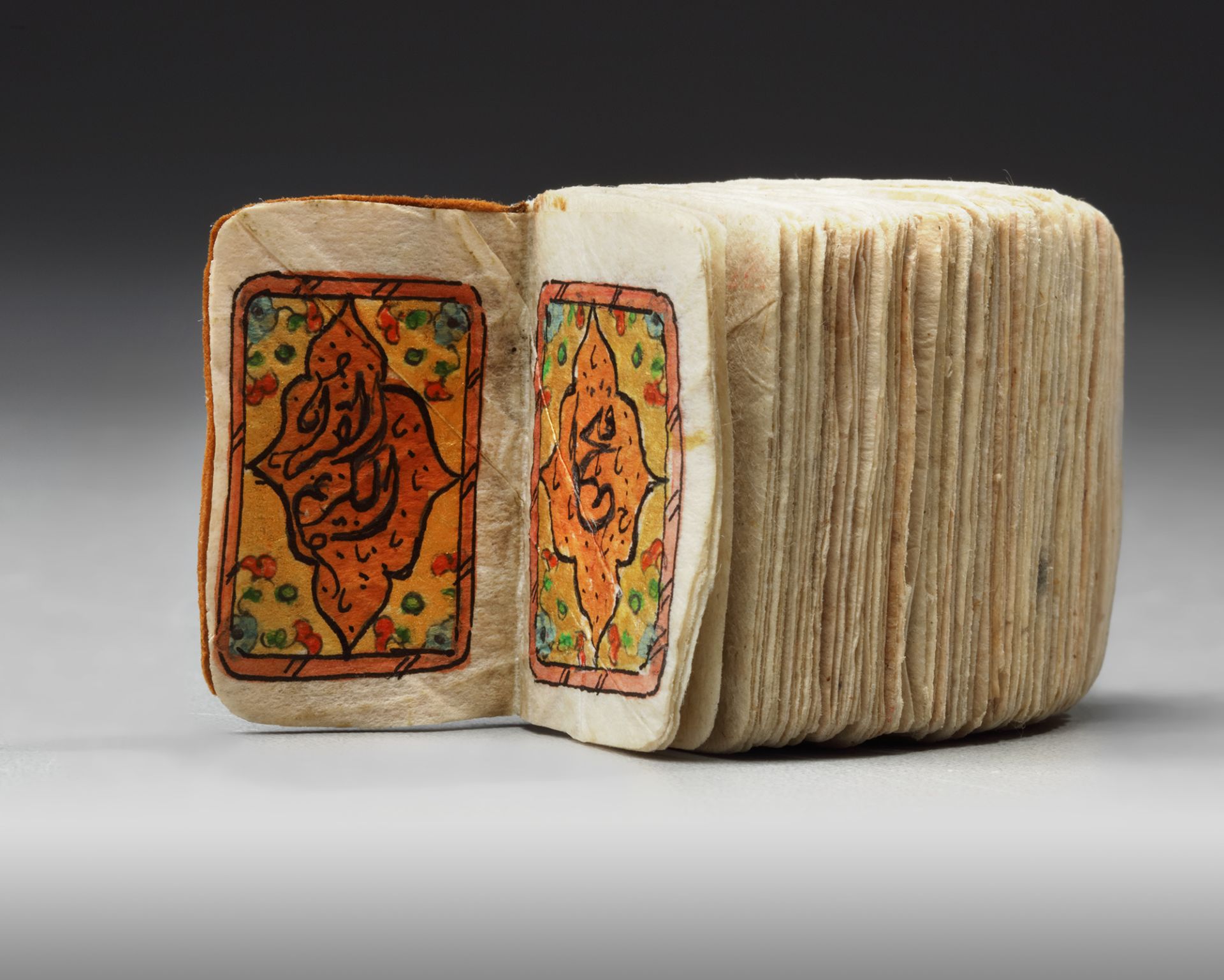 AN ILLUMINATED MINIATURE OTTOMAN QURAN