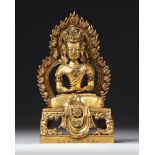 A CHINESE GILT BRONZE SEATED FIGURE OF BUDDHA AMITAYUS