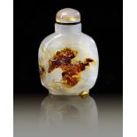 A CHINESE SHADOW AGATE 'LIU HAI' SNUFF BOTTLE