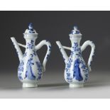 A PAIR OF CHINESE BLUE AND WHITE MOULDED EWERS AND TWO COVERS