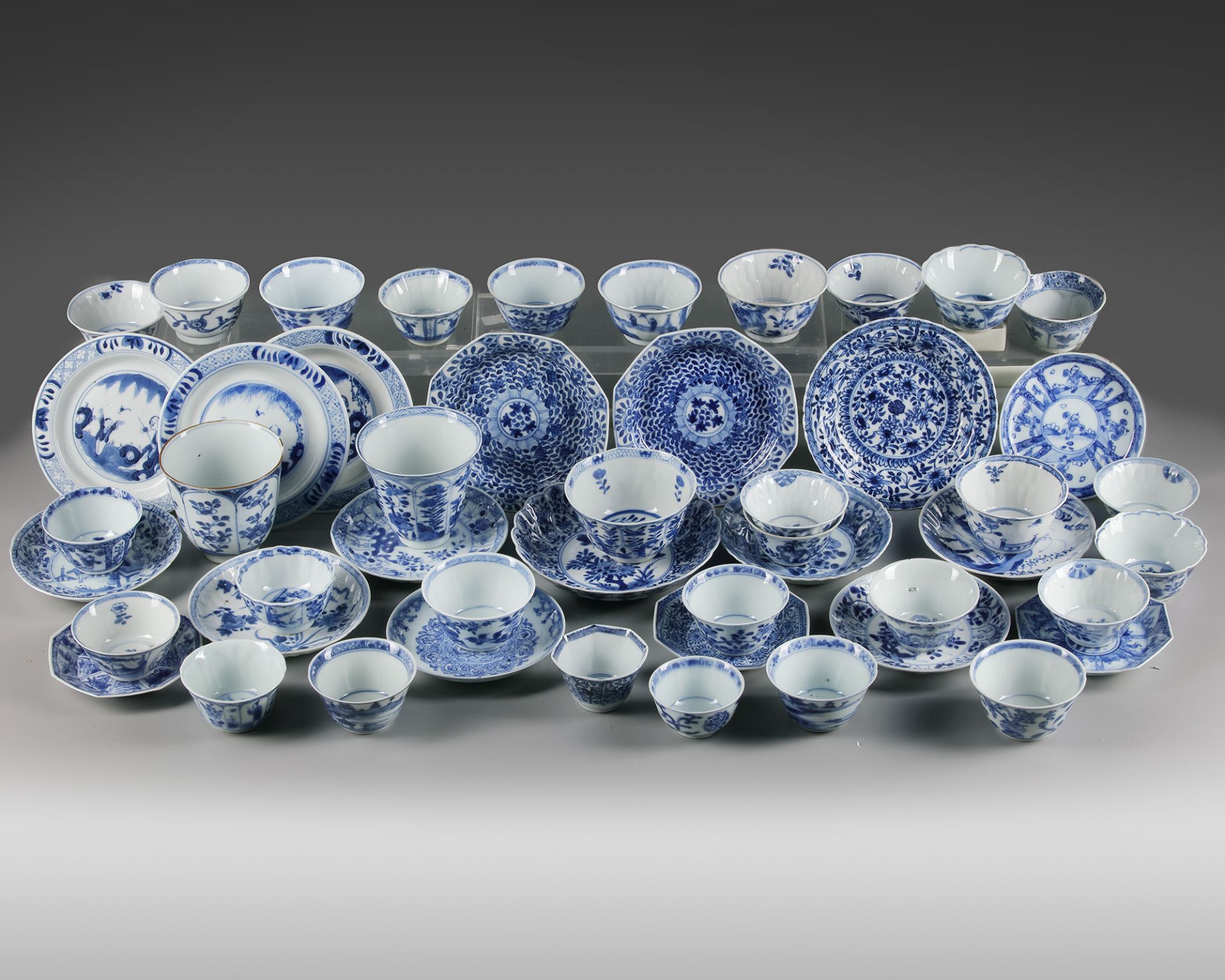 A GROUP OF THIRTY-ONE BLUE AND WHITE CUPS AND EIGHTEEN SAUCERS