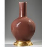 A CHINESE PLUM GLAZED VASE