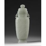 A Chinese pale celadon jade vase and cover