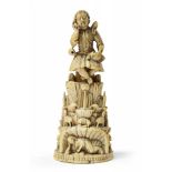 AN INDO-PORTUGUESE CARVED IVORY FIGURE OF CHRIST AS THE GOOD SHEPHERD, INDIA, GOA, 17TH CENTURY