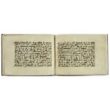 A BOUND GROUP OF TWENTY-NINE LEAVES FROM SEVEN SURAHS OF A DISPERSED MANUSCRIPT OF THE QURAN WRITTEN
