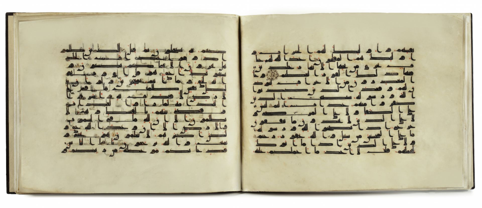 A BOUND GROUP OF TWENTY-NINE LEAVES FROM SEVEN SURAHS OF A DISPERSED MANUSCRIPT OF THE QURAN WRITTEN