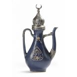 A MING METAL-MOUNTED BLUE-GLAZED EWER FOR THE ISLAMIC MARKET, CHINA, 16TH-17TH CENTURY