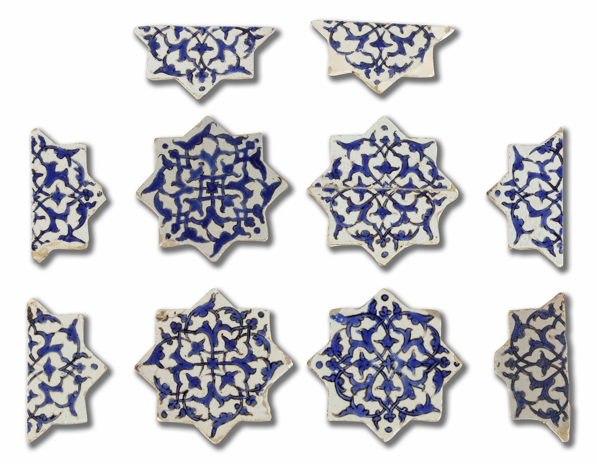 A GROUP OF TIMURID CUERDA SECA POTTERY STAR TILES, PERSIA, LATE 15TH CENTURY