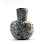 A MOULDED BLUE GLASS BOTTLE, NISHAPUR, NORTH-EAST IRAN, 9TH CENTURY