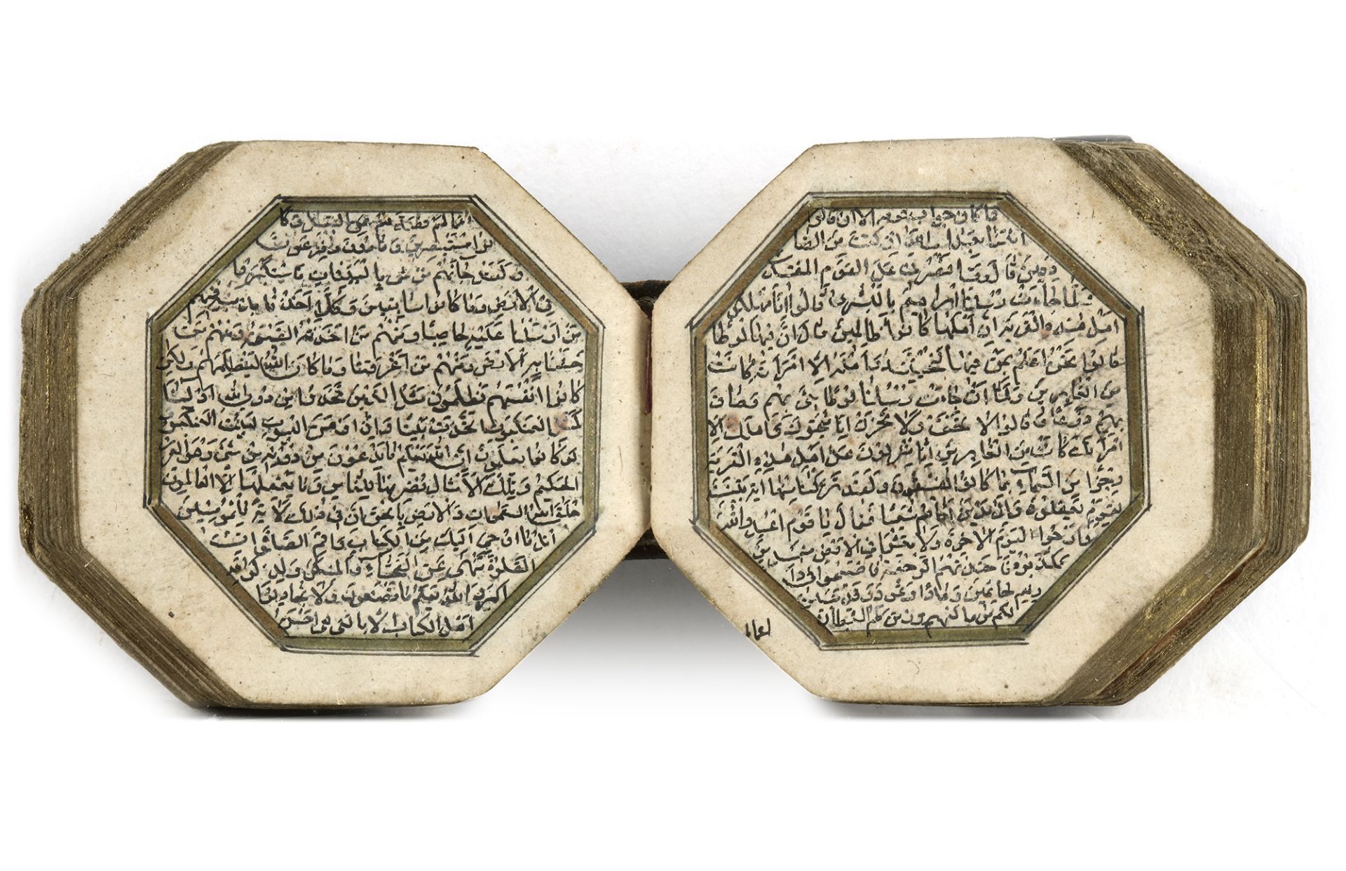 AN ILLUMINATED MINIATURE OCTAGONAL QURAN WITH THE LATER EMBOSSED NAME OF THE OWNER, AHMAD DHU'L KIFL - Image 2 of 7