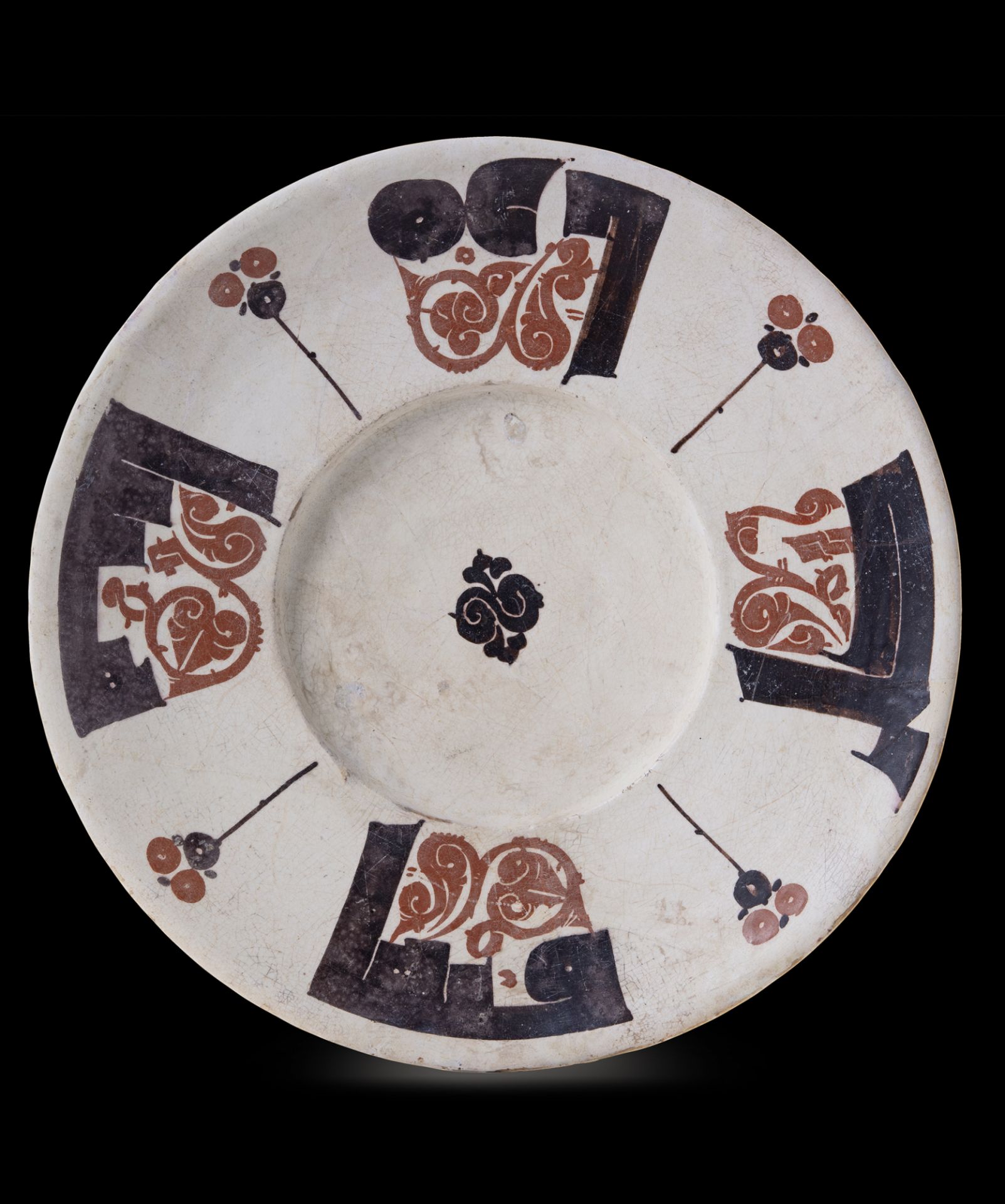 A RARE BICHROME CALLIGRAPHIC POTTERY DISH, NISHAPUR OR SAMARKAND, 10TH CENTURY