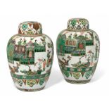 A PAIR OF CHINESE FAMILLE VERTE JARS AND COVERS, KANGXI (1662-1722)