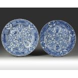 A PAIR OF LARGE CHINESE BLUE AND WHITE PEACOCK CHARGERS, KANGXI PERIOD (1662-1722)