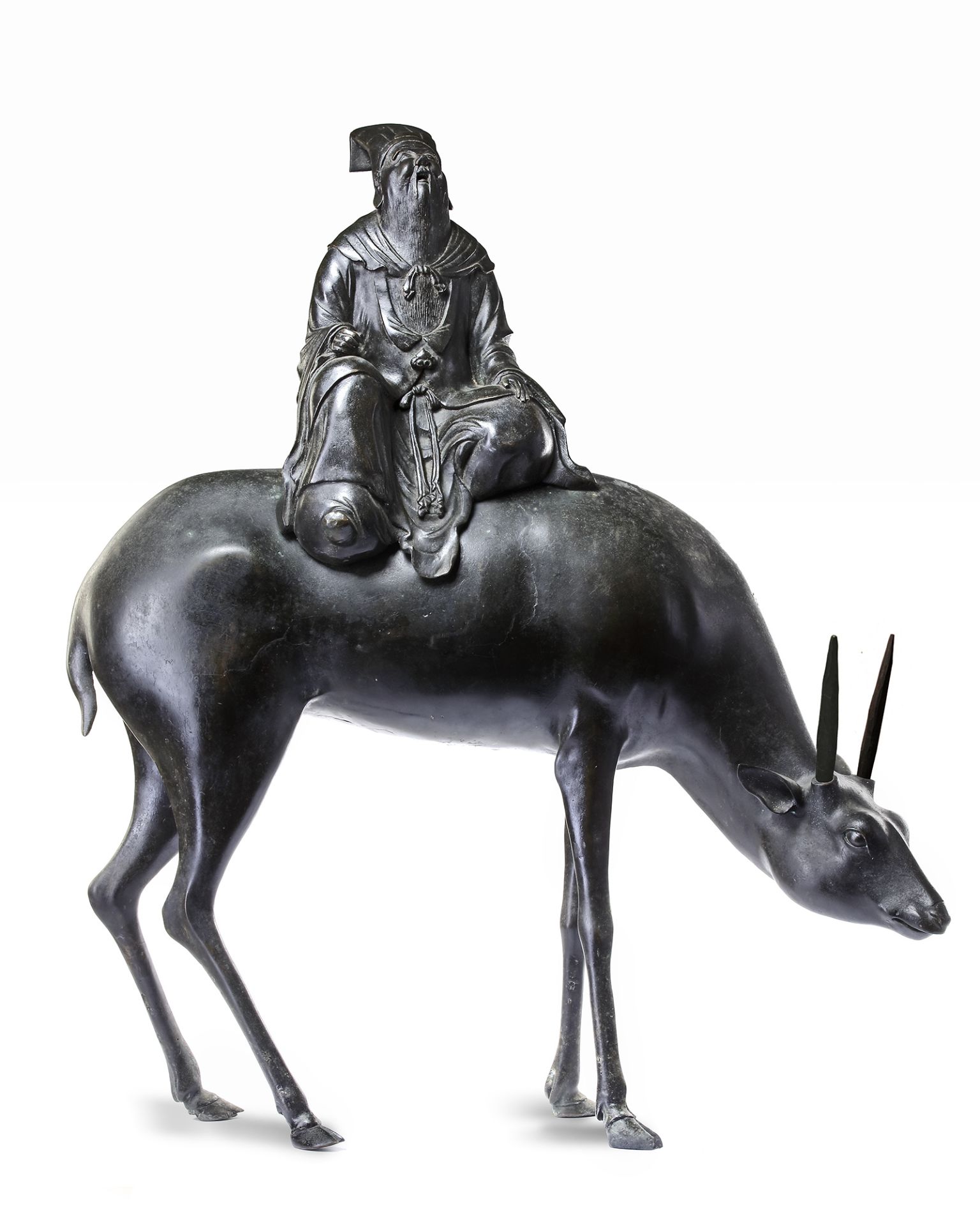 A LARGE CHINESE BRONZE CENSER MODELLED AS A DIGNITARY RIDING A DEER, MING DYNASTY (1368-1644)