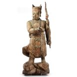 A CHINESE PAINTED AND LACQUERED WOOD FIGURE OF A GUARDIAN, LATE MING DYNASTY (1368-1644)