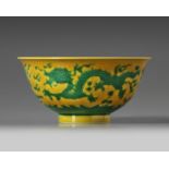 A CHINESE YELLOW-GROUND GREEN-ENAMELLED DRAGON' BOWL, QIANLONG SEAL MARK IN UNDERGLAZE BLUE AND OF T