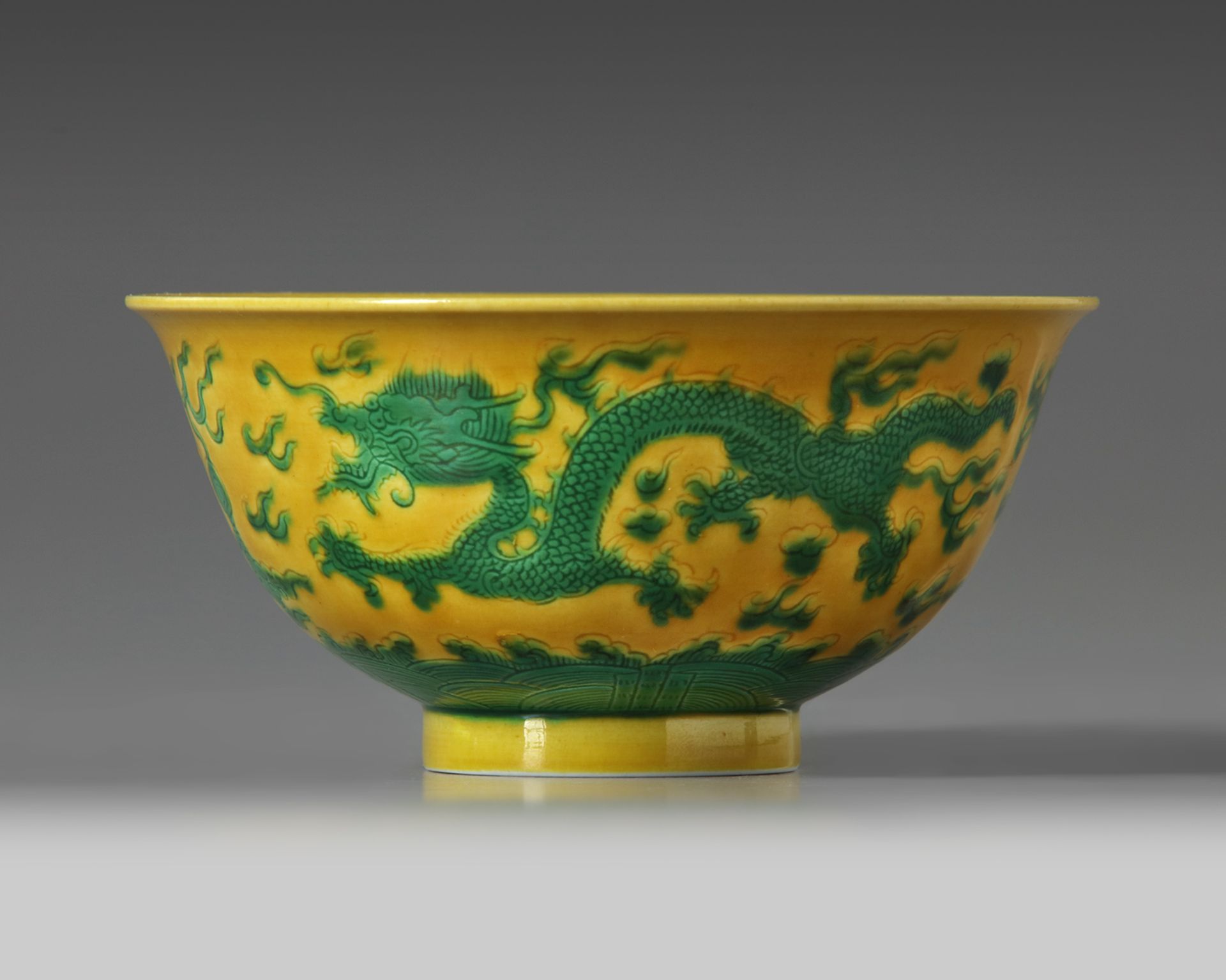 A CHINESE YELLOW-GROUND GREEN-ENAMELLED DRAGON' BOWL, QIANLONG SEAL MARK IN UNDERGLAZE BLUE AND OF T