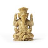 AN INDIAN IVORY SEATED GANESHA,17TH CENTURY