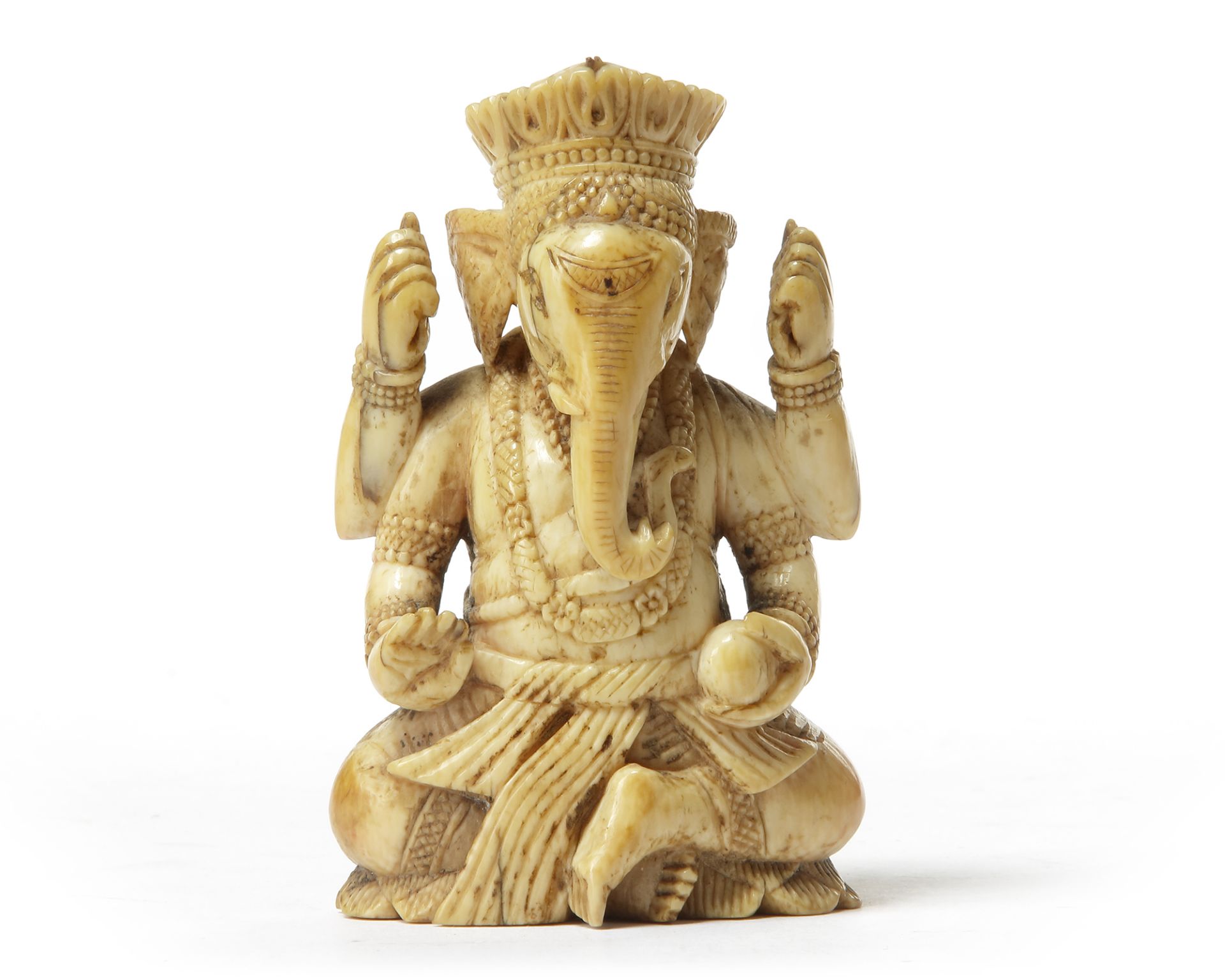 AN INDIAN IVORY SEATED GANESHA,17TH CENTURY