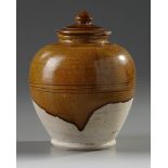 A CHINESE AMBER-GLAZED JAR AND COVER, TANG DYNASTY (618-907)