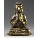 A CHINESE GILT BRONZE FIGURE OF A BUDDHA, LATE MING DYNASTY, 17TH CENTURY