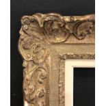 Early 20th Century English School. A Carved Giltwood Frame, with swept corners, and a white slip,