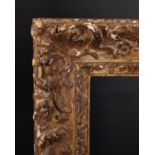 19th Century French School. A Carved Giltwood Frame, with Swept and Pierced Corners, rebate 16" x