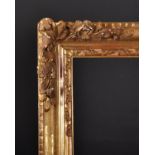 19th Century French School. A Gilt Composition Louis Style Frame, with Swept Corners, rebate 32" x