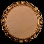 19th Century Italian School. A Carved Giltwood Florentine Frame, Tondo, rebate 20” x 20” (50.8 x