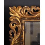 20th Century Italian School. A Carved Giltwood Florentine Frame, with inset mirror glass, rebate 20”
