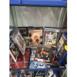 Shelf of PlayStation 2 games.