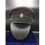 Blue wool service beret with a Royal Logistic Corps badge.