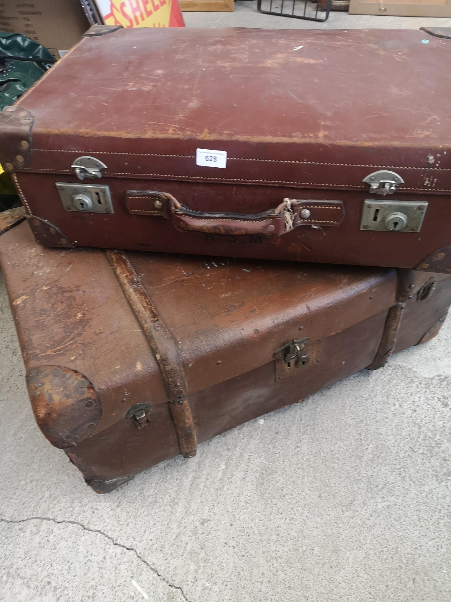 Vintage travel trunk with wooden bounding together with leather travel case.